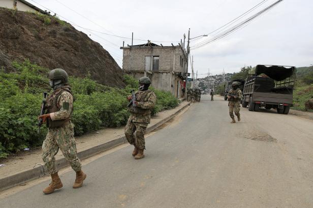 Members of the Security Forces check an area near the Zonal 8 prison, from where Jose Adolfo Macias alias "Fito" disappeared almost a week ago, in Guayaquil