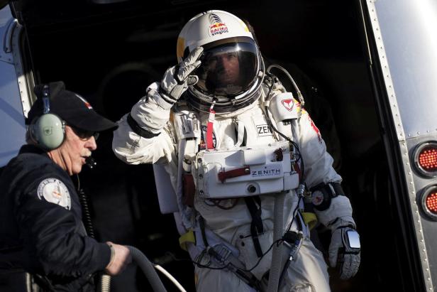 Pilot Felix Baumgartner of Austria walks to the capsule during the first manned test flight for Red Bull Stratos in Roswell Pilot Felix Baumgartner of Austria walks to the capsule during the first manned test flight for Red Bull Stratos in Roswell