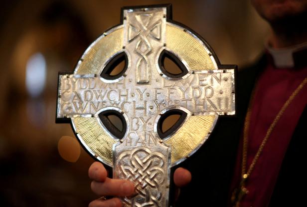 FILE PHOTO: Archbishop of Wales Andrew John poses with the new Cross of Wales which will be used in the procession during the Coronation of Britains King Charles at Holy Trinity Church in Llandudno FILE PHOTO: Archbishop of Wales Andrew John poses with the new Cross of Wales which will be used in the procession during the Coronation of Britains King Charles at Holy Trinity Church in Llandudno