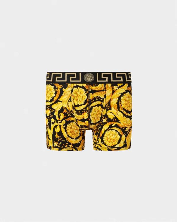 Eine Versace-Boxershort mit einem goldenen Blumenmuster auf schwarzem Grund.