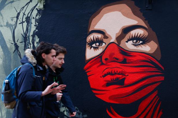 A new mural reminds of the right to protest on the Human Rights Wall in Paris
