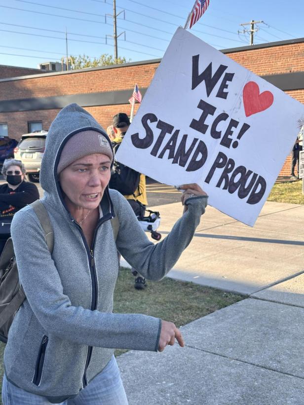 Protesterin in support of Donald Trump and ICE holding up a sign that reads "We love ICE! Stand proud", Boradview, Chicago