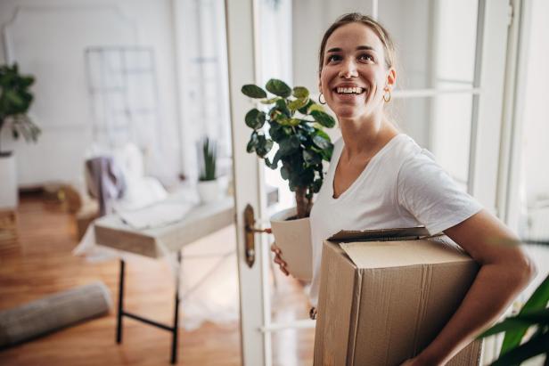 Woman arriving in new apartment