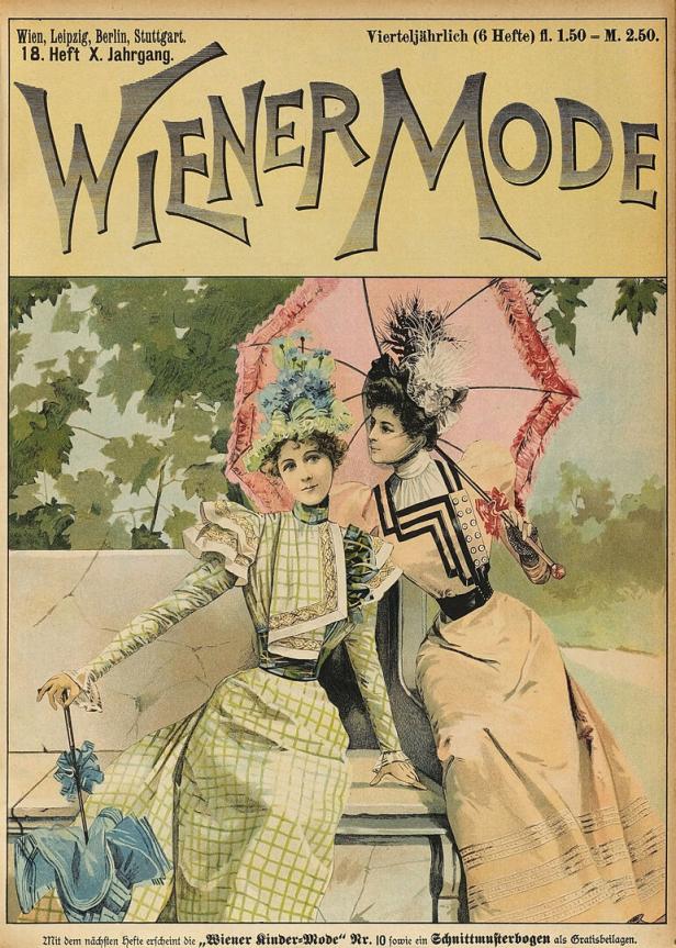 Zwei elegant gekleidete Damen mit Sonnenschirmen posieren für die "Wiener Mode".
