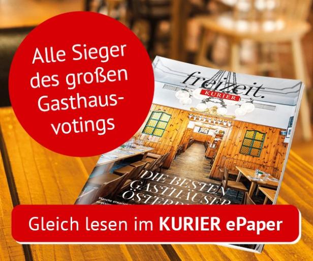 Die Zeitschrift "Freizeit Kurier" mit dem Titel "Die besten Gasthäuser Österreichs" liegt auf einem Tisch.