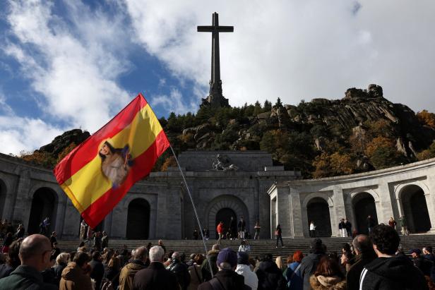 People gather for a praying outside the Valley of Cuelgamuros, in San Lorenzo de El Escorial