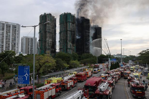 A general view shows the damaged towers of Wang Fuk Court housing estate, where a major fire engulfed bamboo scaffolding across multiple blocks, killing at least 44 people and leaving almost 300 missing, in Tai Po, Hong Kong