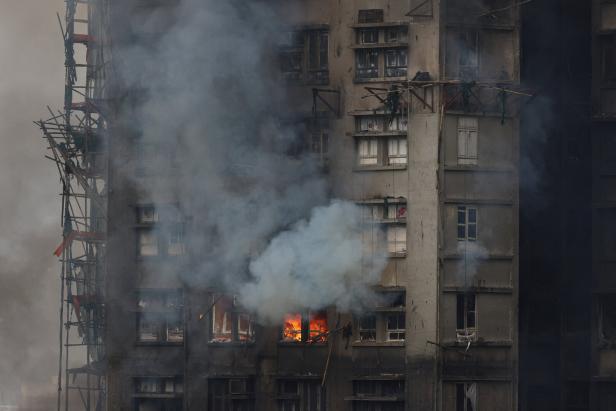 White objects, installed during recent renovations, are seen covering windows at Wang Fuk Court housing estate after a major fire that killed at least 44 people, in Tai Po, Hong Kong
