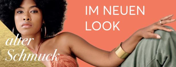 Auf dem Bild ist eine Frau mit großen Ohrringen und einem auffälligen, goldenen Armreifen zu sehen.