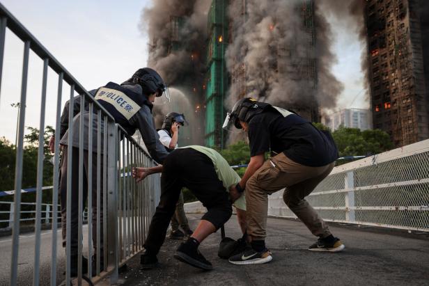 A picture and its story: The photo that became a symbol for Hong Kong's deadly fire