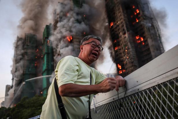 A picture and its story: The photo that became a symbol for Hong Kong's deadly fire