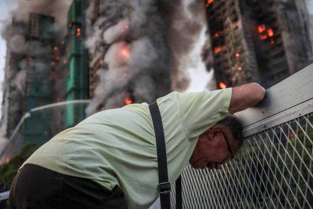 A picture and its story: The photo that became a symbol for Hong Kong's deadly fire