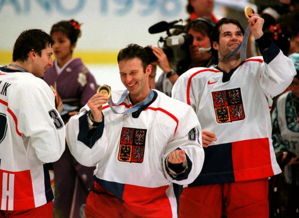 FILE PHOTO: CZECH REPUBLIC'S SMEHLIK, HASEK, AND LANG LOOK AT OLYMPIC GOLD MEDALS