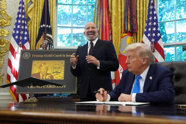 U.S. President Donald Trump signs executive orders in the Oval Office at the White House in Washington