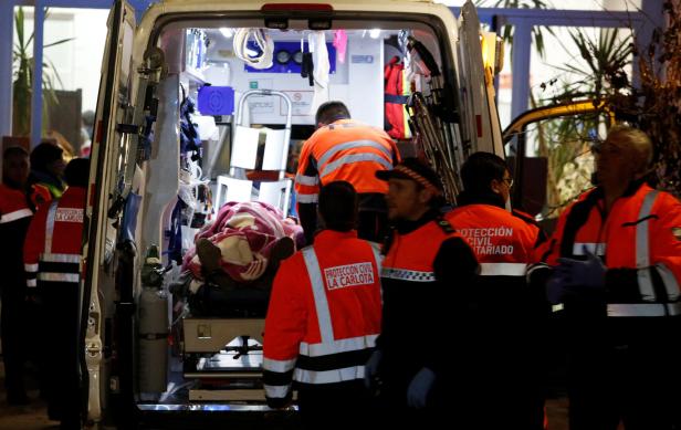 People affected by a deadly train derailment are transferred and treated at the Caseta Municipal in the town of Adamuz