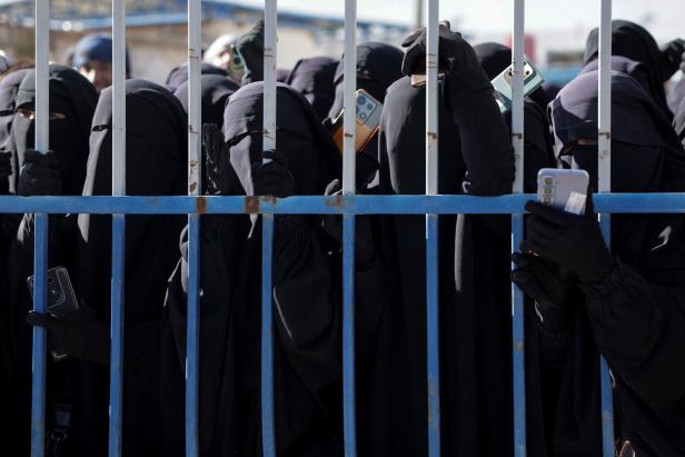 Detainees gather at al-Hol camp after the Syrian government took control of it, in Hasaka