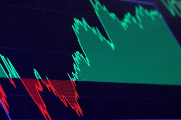 FILE PHOTO: A screen shows trading numbers after the closing bell on the floor at the NYSE in New York