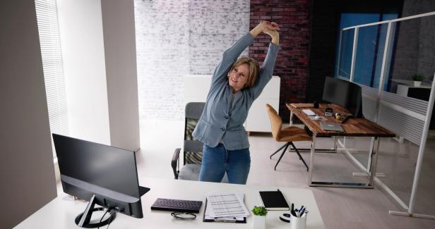Arms Stretch Exercise Standing Near Desk