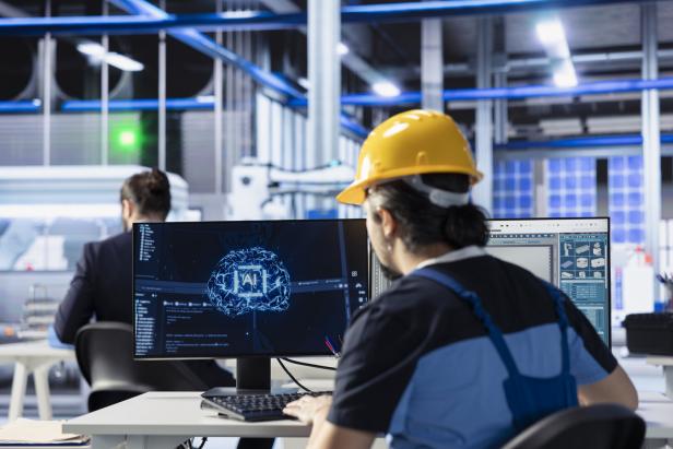 Engineer developing AI diagnostics tool in photovoltaic factory