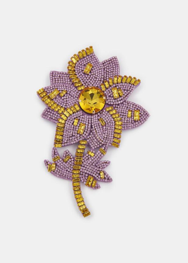 Lila Brosche mit goldenen Details