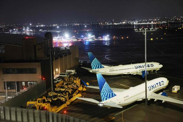 US-AIR-CANADA-EXPRESS-PLANE-COLLIDES-WITH-FIRE-TRUCK-AT-LAGUARDI