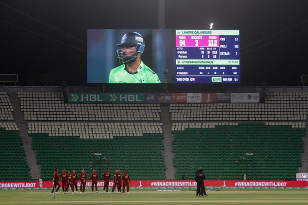View of desered enclosures during Pakistan Super League PSL 11 Cricket match played without spectators, as part of austerity measures to save fuel, in Lahore