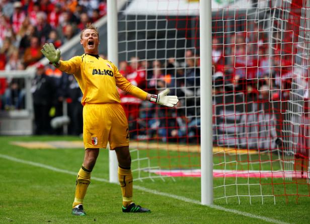 FILE PHOTO: Augsburg's goalkeeper Alex Manninger reacts during their German first division Bundesliga soccer match against Bayern Munich in Munich