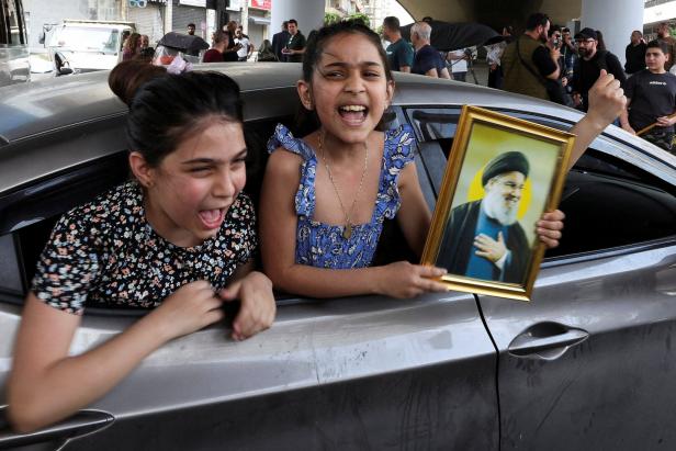 Displaced people return to their homes after a 10-day ceasefire between Lebanon and Israel went into effect, at the southern suburbs of Beirut