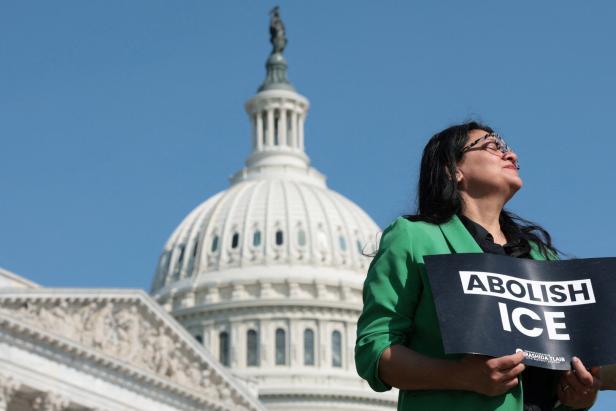 U.S. Representative Tlaib holds an Abolish ICE placard during a news conference at the U.S. Capitol in Washington