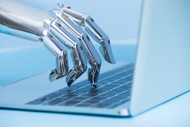 robot hand use notebook work