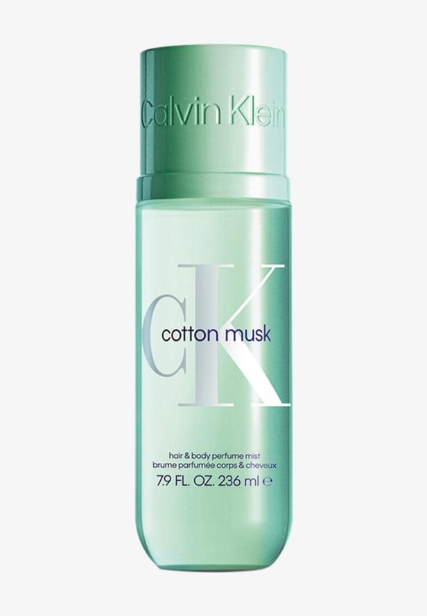Mintgrüne Sprühflasche mit der Aufschrift „cotton musk“ und „Calvin Klein“ für Haar und Körper.