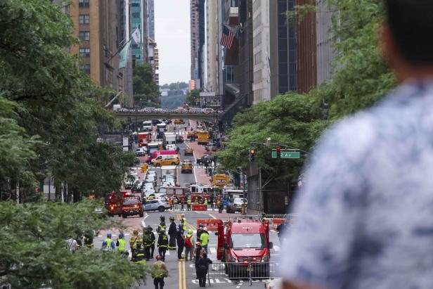 Emergency services respond to a 38-story Midtown Manhattan building
