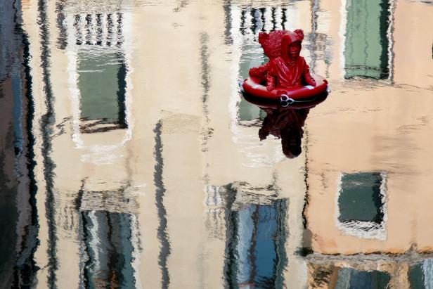 James Colominas unauthorized artwork "Nothing Serious"  floats on the Rio di San Felice in Venice