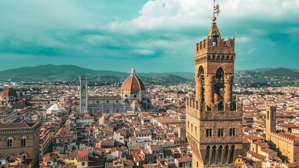 Palazzo Vecchio Clock Tower in Florence, aerial view of Palazzo Vecchio in Florence, Historically and Culturally Rich Italian Town Florence, Firenze - Aerial view of the city of Florence, Popular tourist destination in the world
