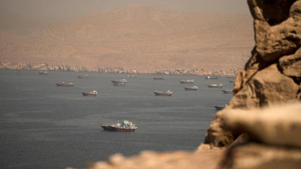 FILE PHOTO: Iran-linked vessels pass through Hormuz ahead of US blockade