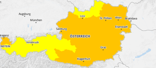 Österreichkarte mit orange und gelb markierten Hitzewarngebieten.
