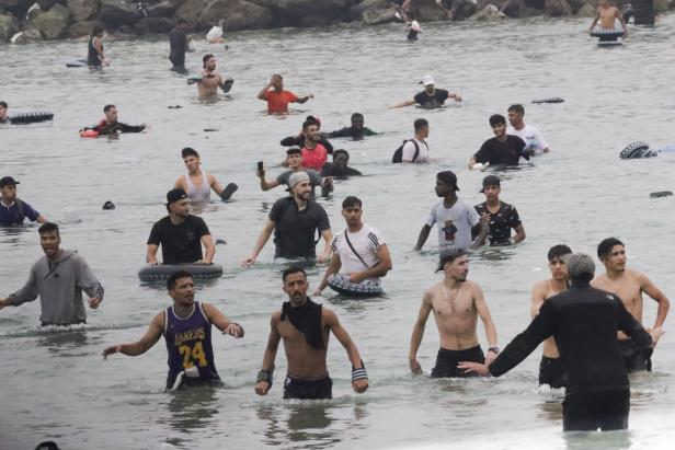Thousands of migrants enter Spanish enclaves in North Africa