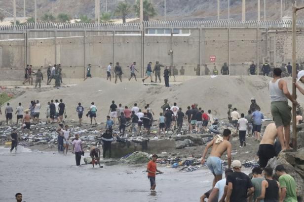 Thousands of migrants enter Spanish enclaves in North Africa