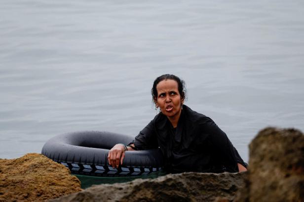 Migrants cross into the Spanish enclave of Ceuta