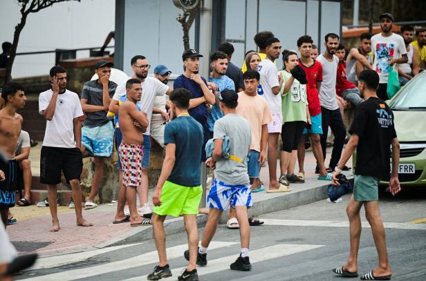 Migrants gather in downtown Ceuta