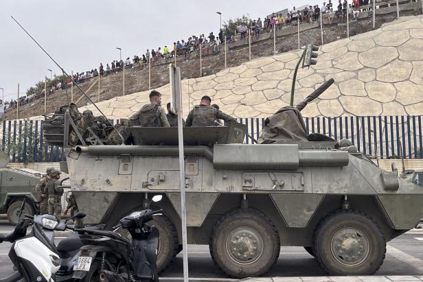 Thousands of migrants enter Spanish enclaves in North Africa