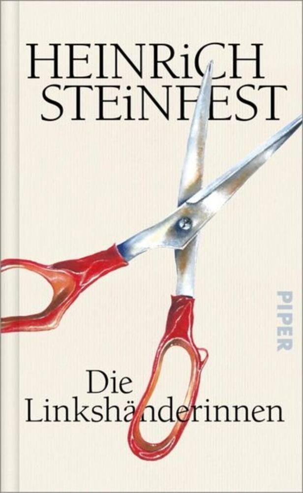Das Buchcover von Heinrich Steinfest „Die Linkshänderinnen“ zeigt eine geöffnete Schere mit roten Griffen auf hellem Hintergrund.