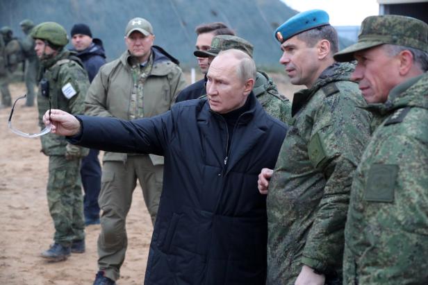 Russian President Vladimir Putin inspects the progress of mobilized servicemen's training at a training range