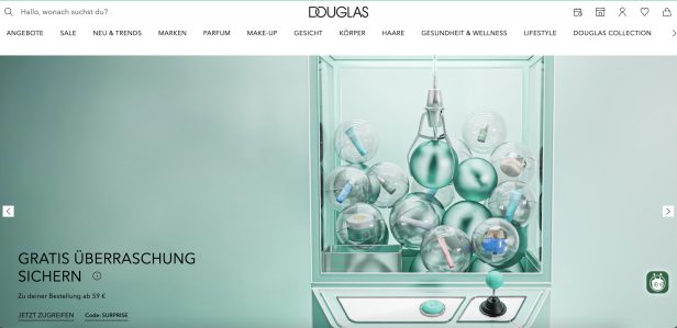 Douglas-Startseite mit Werbebanner für eine Gratis-Überraschung.