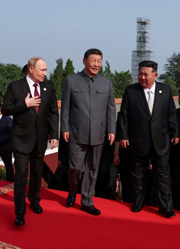 FILE PHOTO: Russian President Vladimir Putin, Chinese President Xi Jinping and North Korean leader Kim Jong Un in Beijing