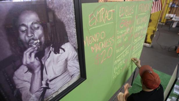 File photo of a portrait of Bob Marley hanging nex