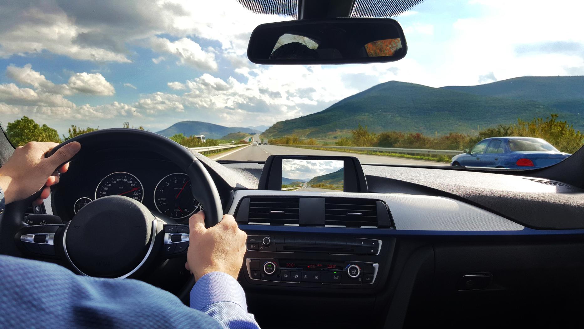 Driving place place. Car Dash. Car Steering Wheel view. Car dashboard. Car inside view.
