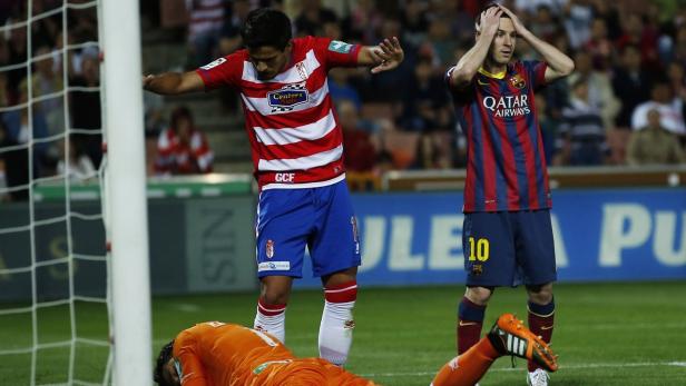 Barcelona's Lionel Messi reacts after missing a sc