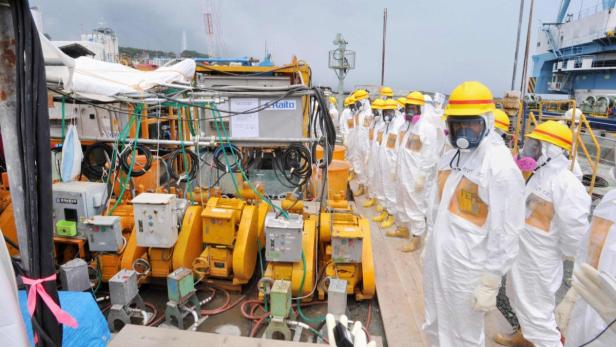 Members of a Fukushima prefecture panel, which monitors the safe decommissioning of the nuclear plant, inspect the construction site of the shore barrier, which is meant to stop radioactive water from leaking into the sea, near the No.1 and No.2 reactor building of the tsunami-crippled Fukushima Daiichi nuclear power plant in Fukushima, in this photo released by Kyodo August 6, 2013. Highly radioactive water seeping into the ocean from Japan&#039;s crippled Fukushima nuclear plant is creating an &quot;emergency&quot; that the operator is struggling to contain, an official from the country&#039;s nuclear watchdog said on Monday. Mandatory Credit. REUTERS/Kyodo (JAPAN - Tags: DISASTER BUSINESS POLITICS CONSTRUCTION HEALTH) ATTENTION EDITOR - FOR EDITORIAL USE ONLY. NOT FOR SALE FOR MARKETING OR ADVERTISING CAMPAIGNS. THIS IMAGE HAS BEEN SUPPLIED BY A THIRD PARTY. IT IS DISTRIBUTED, EXACTLY AS RECEIVED BY REUTERS, AS A SERVICE TO CLIENTS. MANDATORY CREDIT. JAPAN OUT. NO COMMERCIAL OR EDITORIAL SALES IN JAPAN. YES