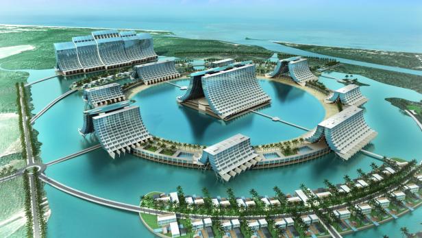 Ein luxuriöses Resort mit ungewöhnlicher Architektur liegt auf einer tropischen Insel.